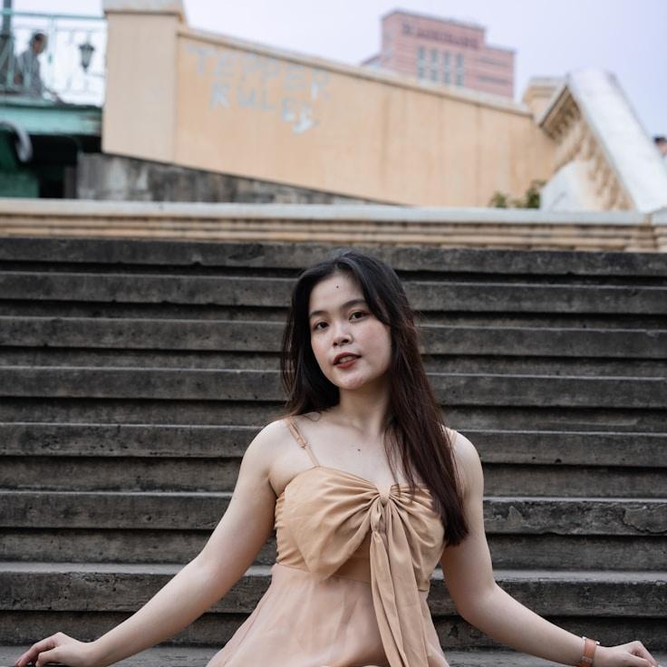 Avery Singh, Lead Design Curator at Astroni Venta, reviewing corporate floral arrangements